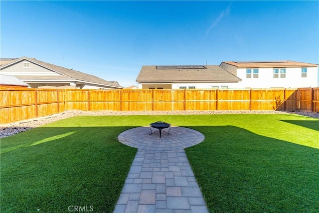 view of yard featuring a patio and a fire pit