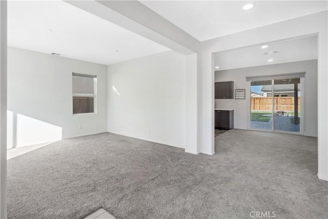 unfurnished living room with carpet