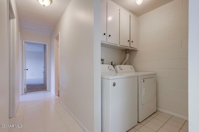 washroom with cabinets, light tile patterned floors, and independent washer and dryer