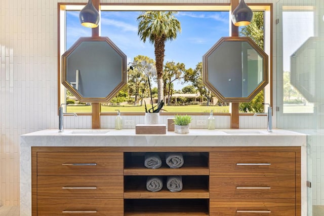 interior space with light stone counters and sink