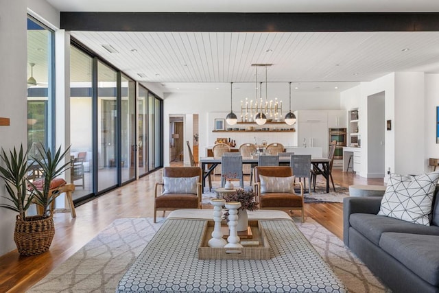 living room featuring expansive windows and light wood-type flooring