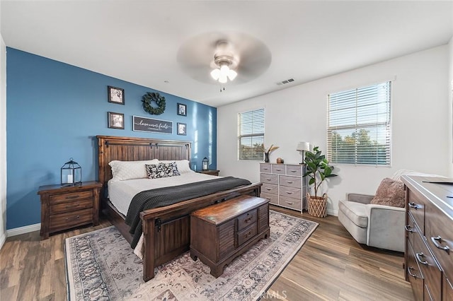 bedroom featuring ceiling fan and hardwood / wood-style floors