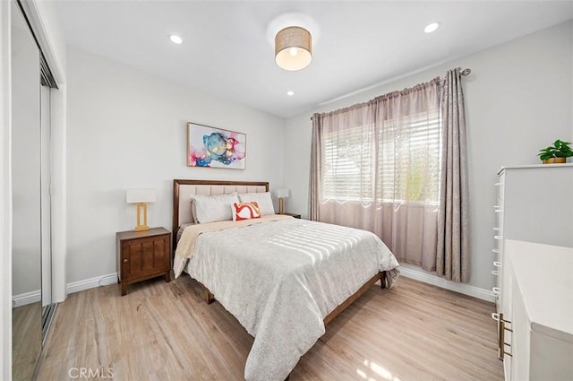 bedroom featuring a closet and light hardwood / wood-style floors