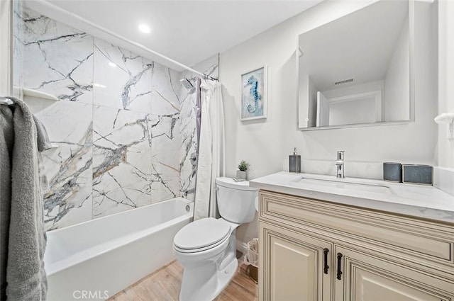 full bathroom with hardwood / wood-style floors, toilet, vanity, and shower / bath combination with curtain