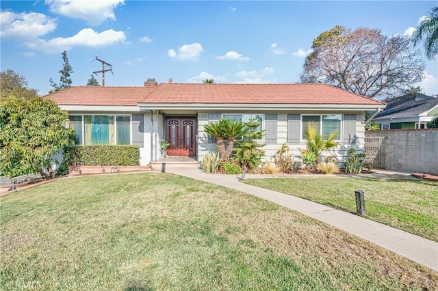 single story home featuring a front yard