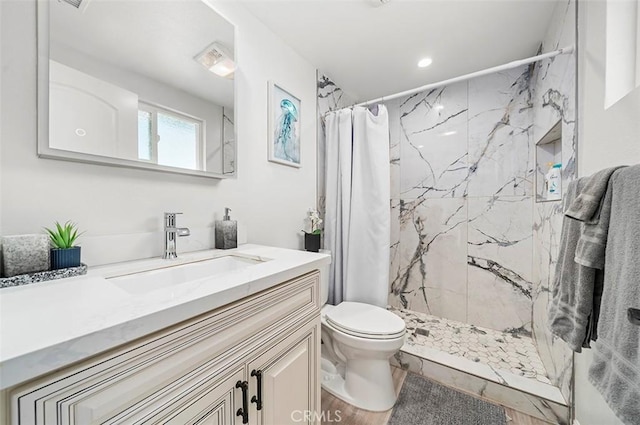 bathroom with toilet, a shower with shower curtain, wood-type flooring, and vanity