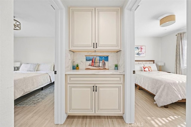 bedroom with light hardwood / wood-style floors