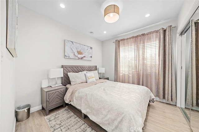 bedroom with light wood-type flooring