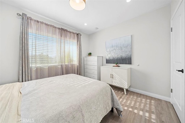 bedroom featuring wood-type flooring