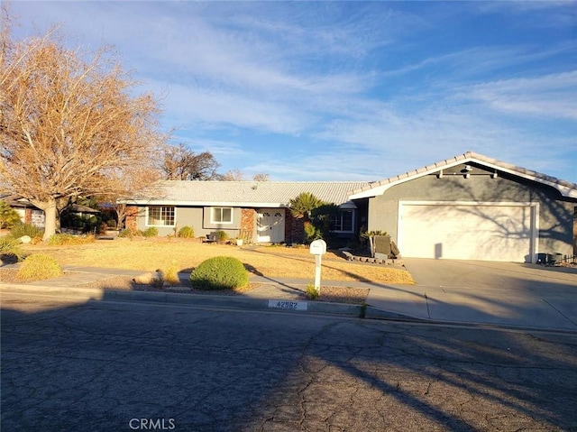 ranch-style home featuring a garage