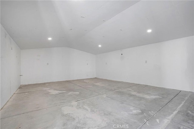 empty room with vaulted ceiling