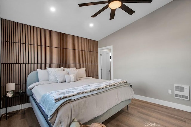 bedroom with ceiling fan, dark wood-type flooring, and lofted ceiling