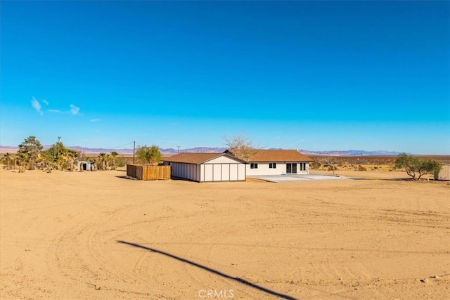 exterior space with a rural view and a mountain view