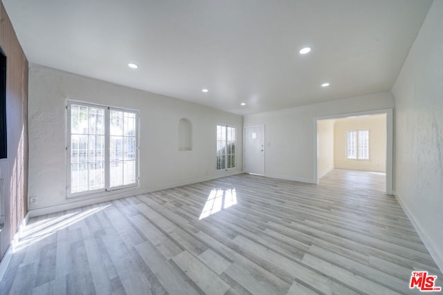 spare room with light wood-type flooring