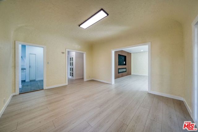 spare room featuring light hardwood / wood-style flooring