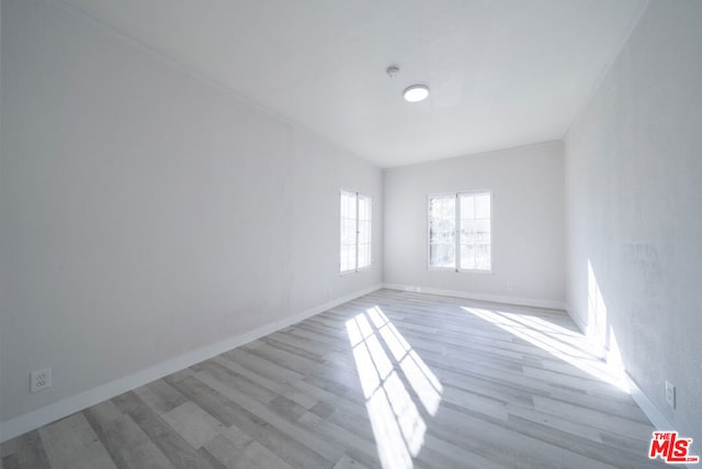 unfurnished room with light hardwood / wood-style flooring