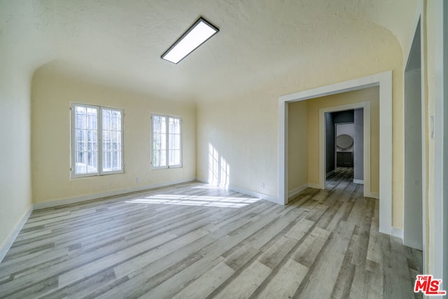 spare room with light hardwood / wood-style floors