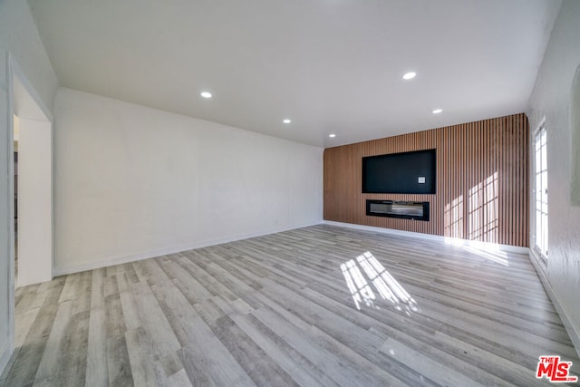 unfurnished living room featuring light hardwood / wood-style flooring