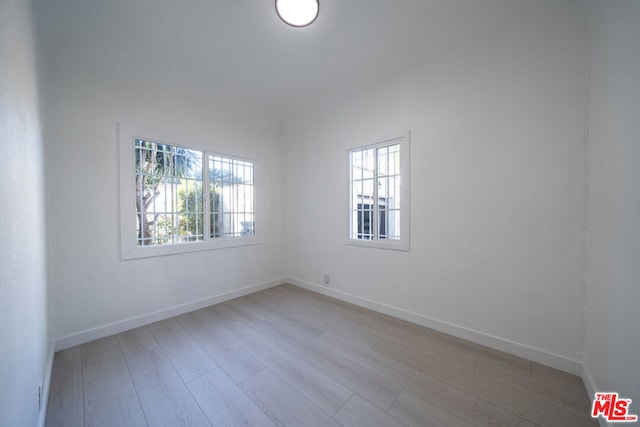 empty room with light hardwood / wood-style floors