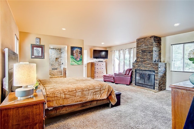 carpeted bedroom featuring a fireplace