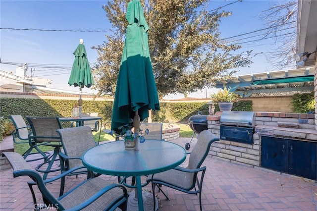 view of patio / terrace with an outdoor kitchen and area for grilling