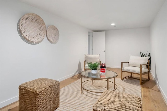 living area with light hardwood / wood-style flooring