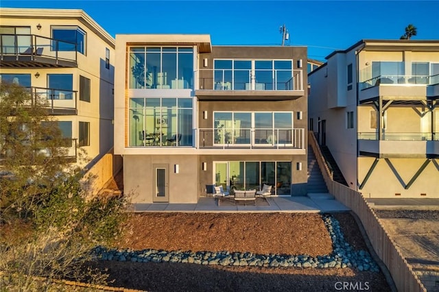 back of property featuring a patio