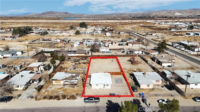 birds eye view of property with a mountain view