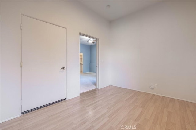 unfurnished bedroom with light wood-style flooring