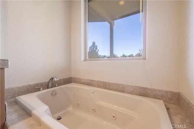 full bathroom with a jetted tub