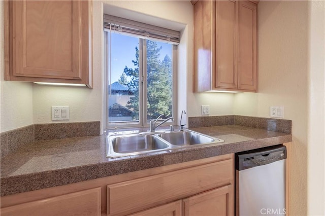 kitchen featuring a sink, stainless steel dishwasher, and light brown cabinetry