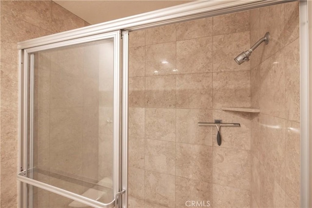 bathroom with a shower stall