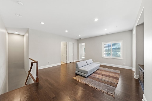 sitting room with dark wood-type flooring