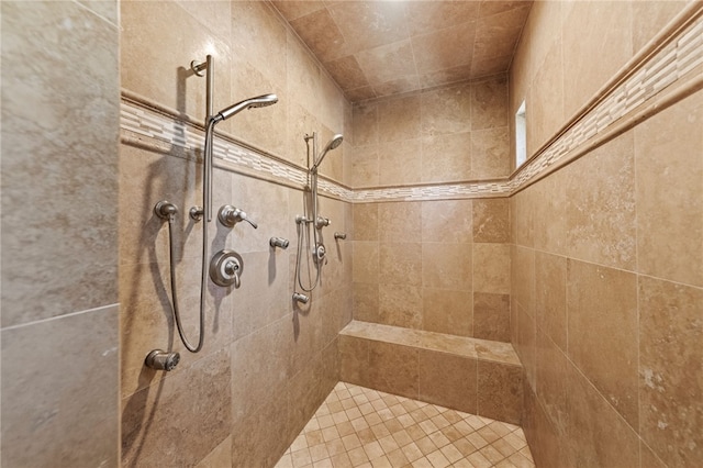 bathroom with tiled shower