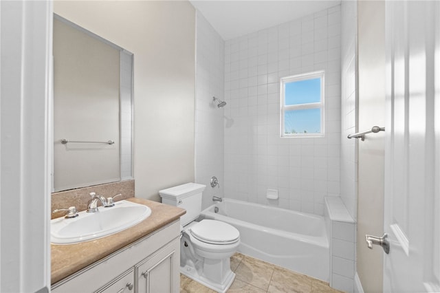 full bathroom with toilet, tiled shower / bath combo, tile patterned floors, and vanity