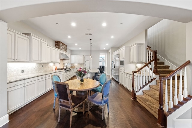 dining room with dark wood-type flooring