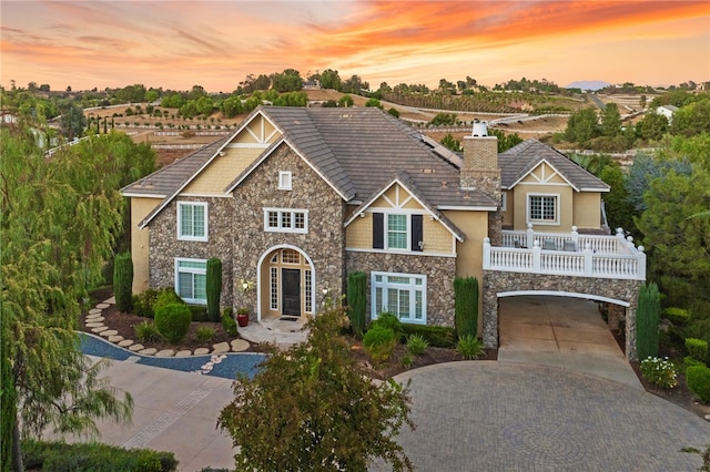 view of front of home with a garage and french doors