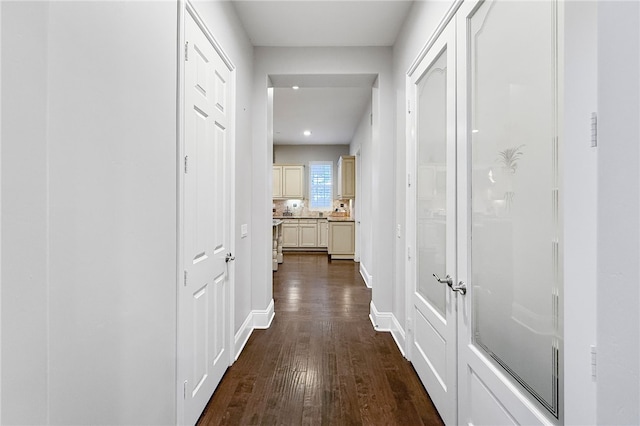 corridor featuring dark hardwood / wood-style flooring