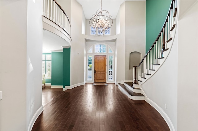 foyer featuring a notable chandelier, a high ceiling, and hardwood / wood-style flooring