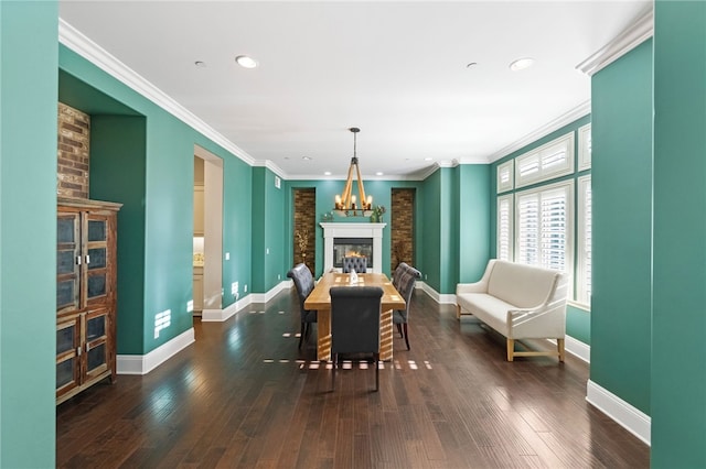 dining room with dark wood-type flooring and ornamental molding