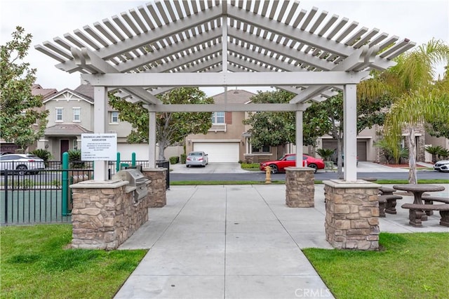 view of patio with a pergola and area for grilling