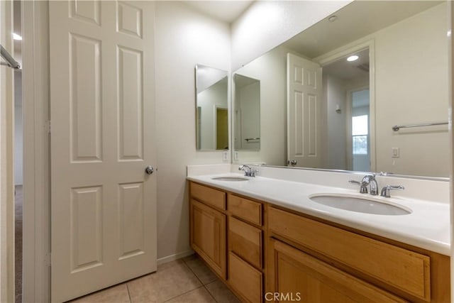 bathroom featuring tile patterned floors and vanity