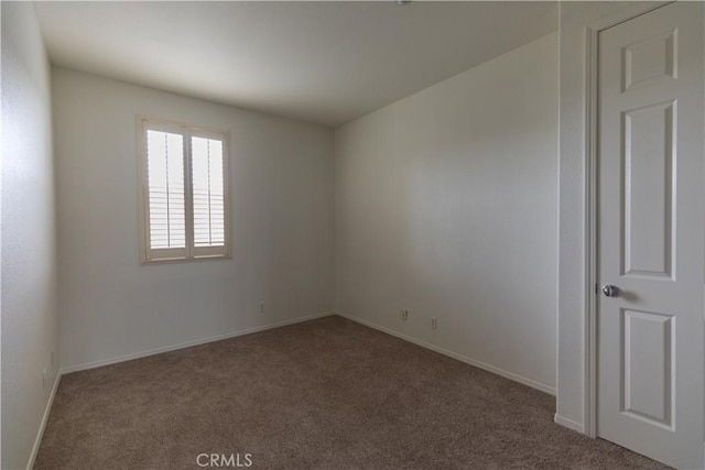 spare room featuring carpet flooring