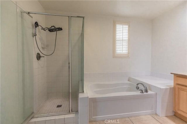 bathroom with tile patterned floors, vanity, and separate shower and tub