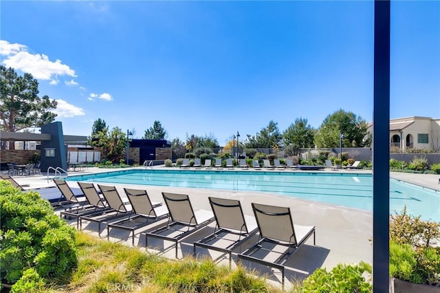 view of swimming pool featuring a patio area