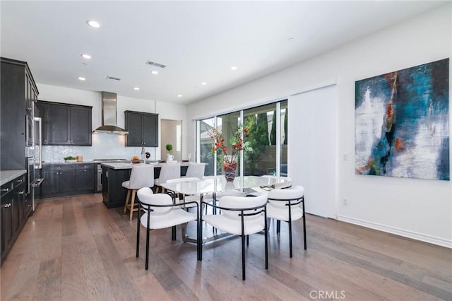 dining space featuring hardwood / wood-style flooring