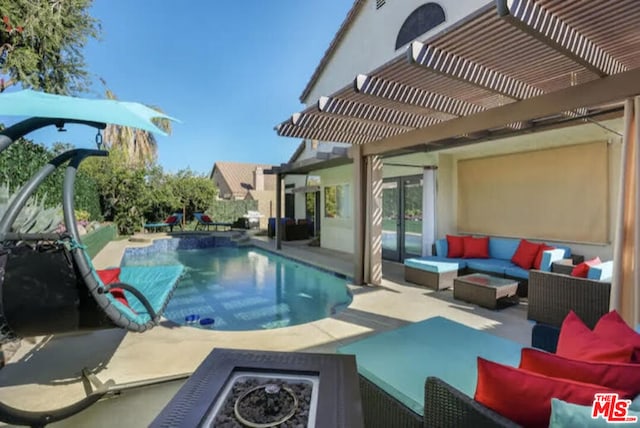 view of pool featuring a pergola, an outdoor living space with a fire pit, and a patio