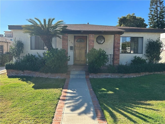 ranch-style house with a front lawn