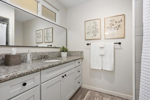 bathroom featuring hardwood / wood-style floors and vanity