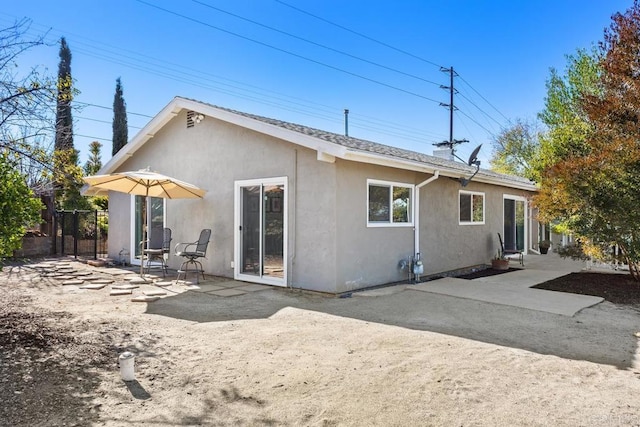 rear view of property with a patio area